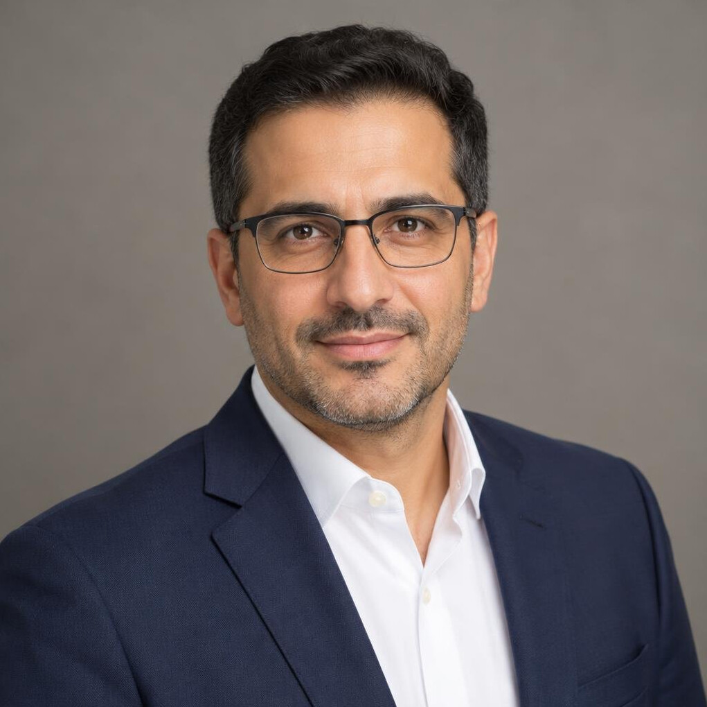 Studio portrait of a Middle Eastern German man researcher in his forties