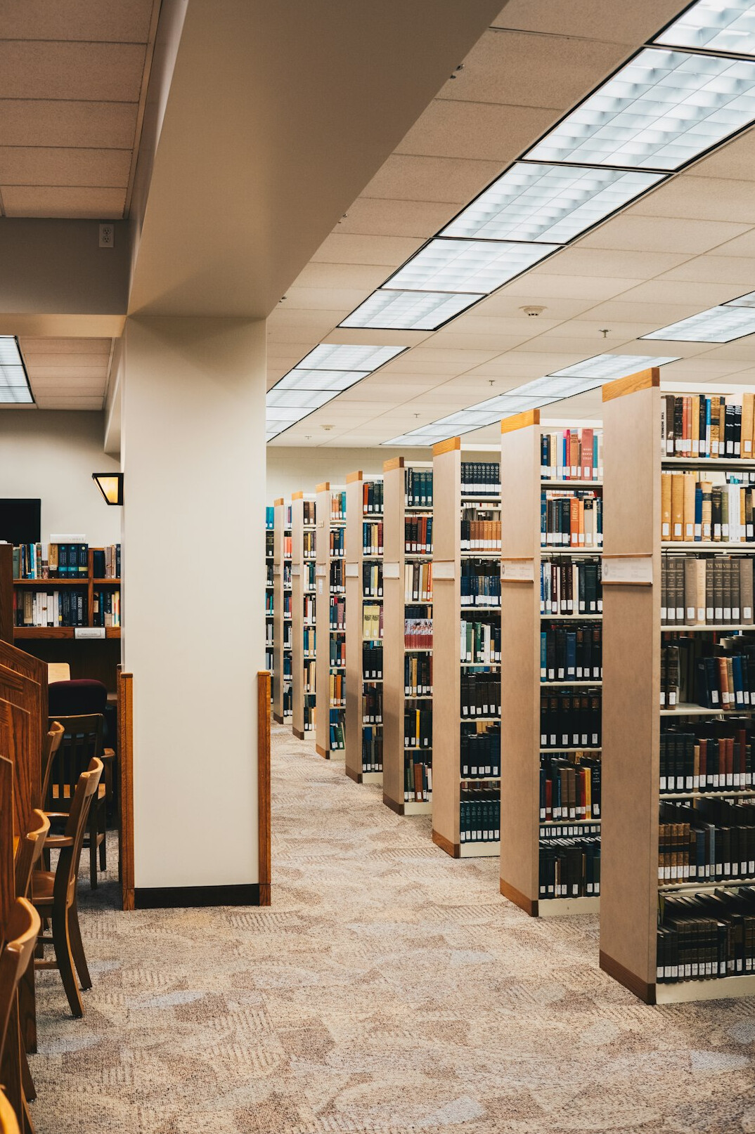 Empty library reading room with rows of chairs
